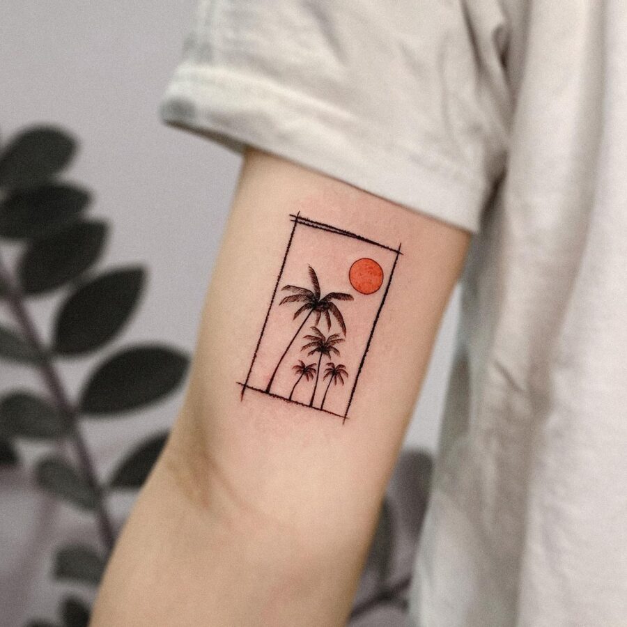 Minimalist palm tree tattoo with sunset vibes Tattoo on skin