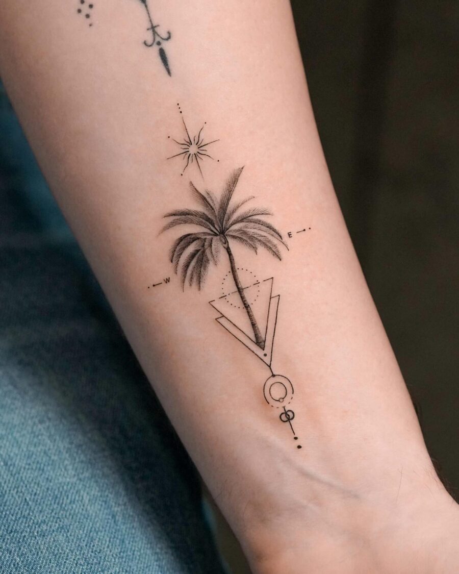 Stylish palm tree tattoo with geometric elements Tattoo on skin