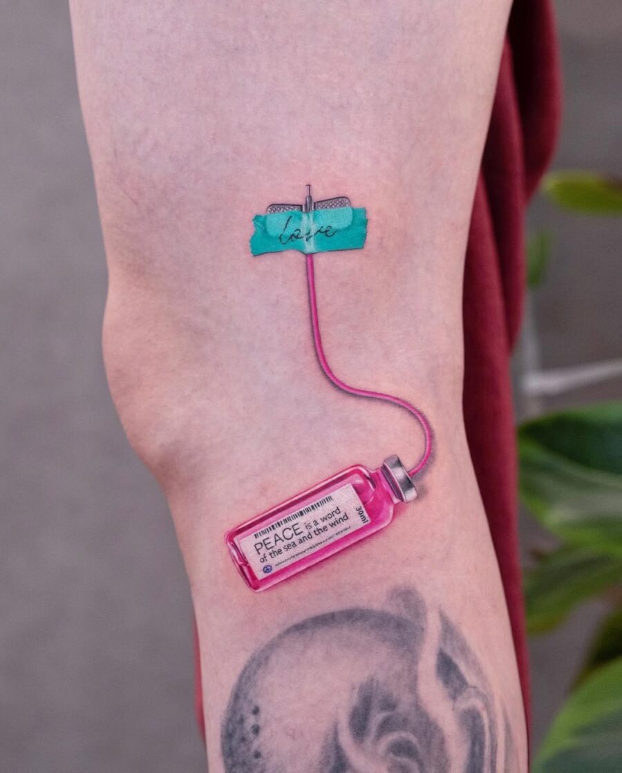 A unique peace-themed syringe tattoo design Tattoo on skin