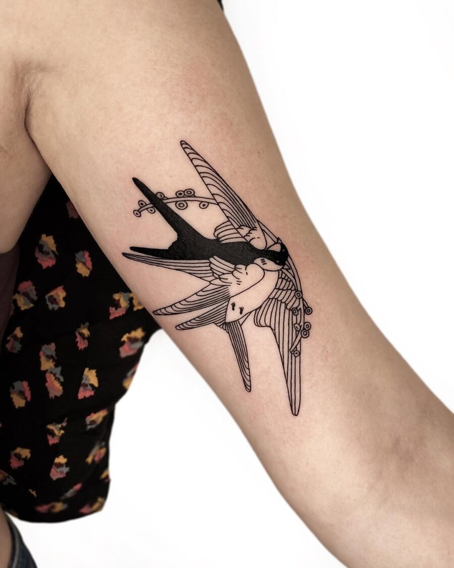 Artistic swallow tattoo representing freedom and peace Tattoo on skin