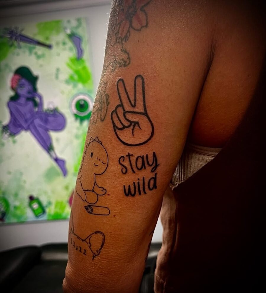 Celebrate individuality with playful peace tattoos Tattoo on skin