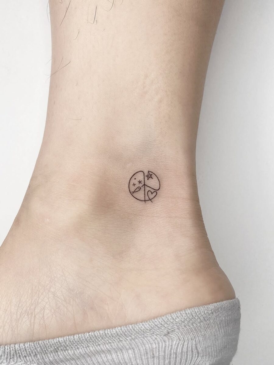 Charming minimalist peace symbol tattoo design Tattoo on skin