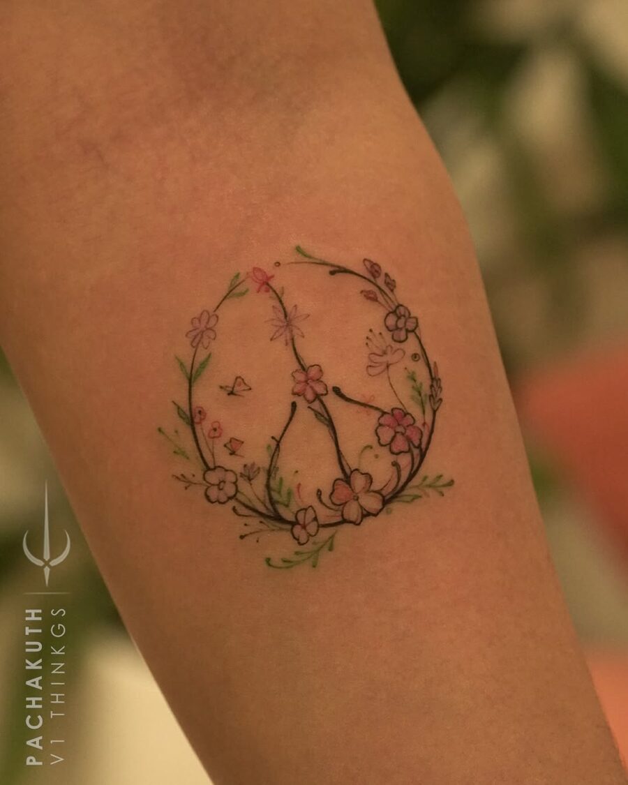Floral Peace Sign Tattoo Illustrates Serenity Tattoo on skin