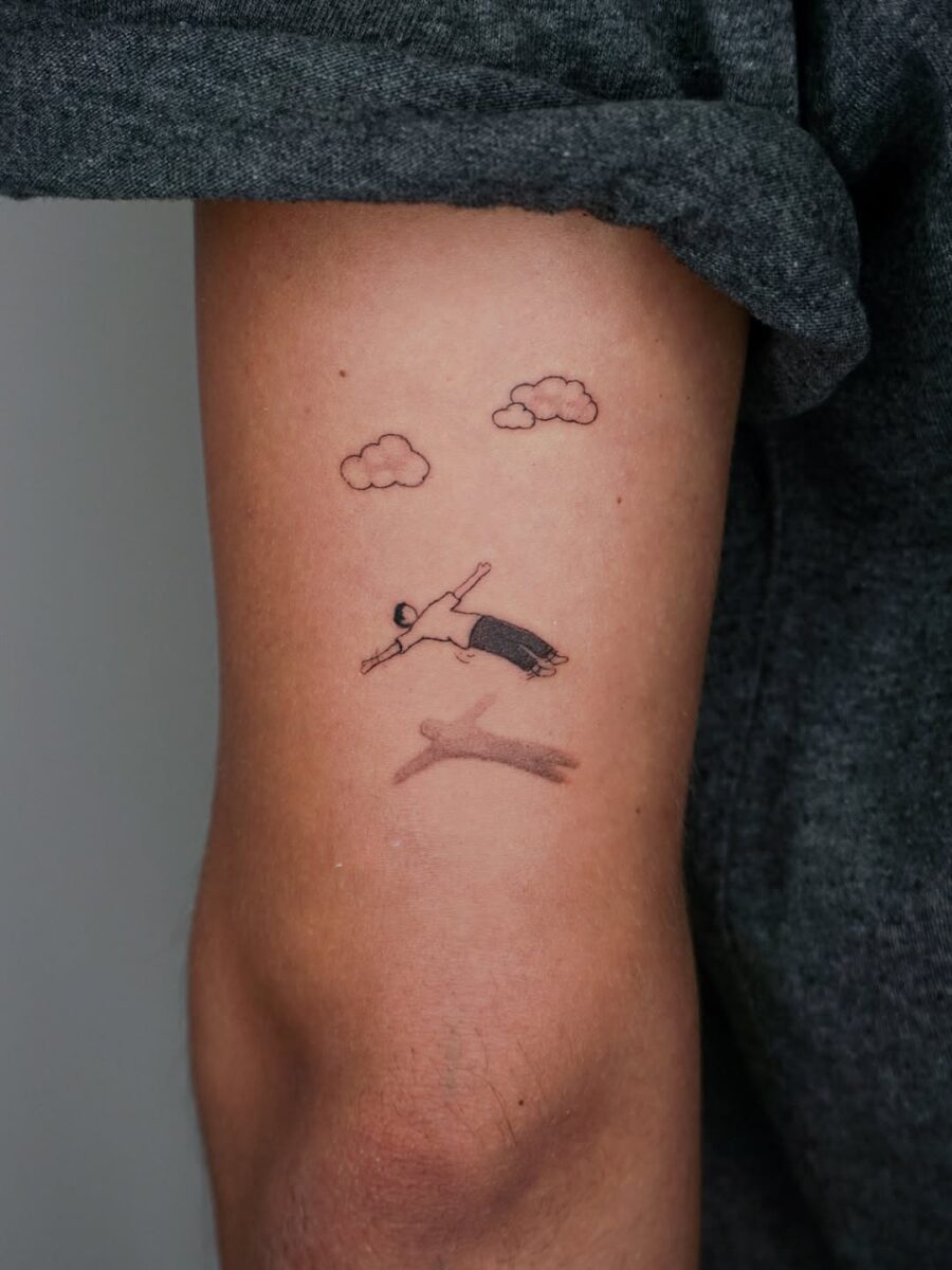 Minimalist swim tattoo for tranquility seekers Tattoo on skin
