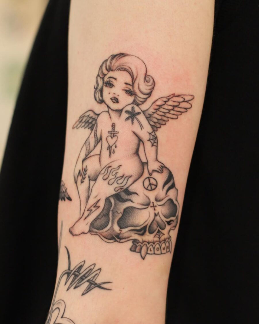 Unique angel tattoo radiating peace vibes Tattoo on skin