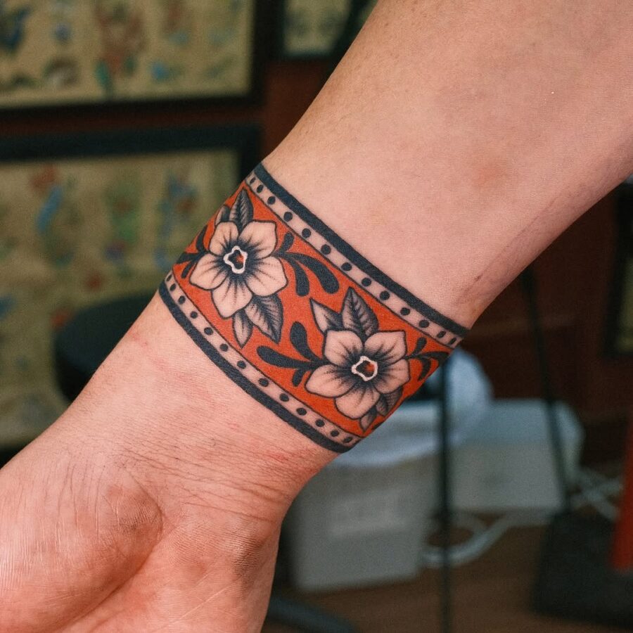 Vibrant floral peace tattoo on wrist Tattoo on skin
