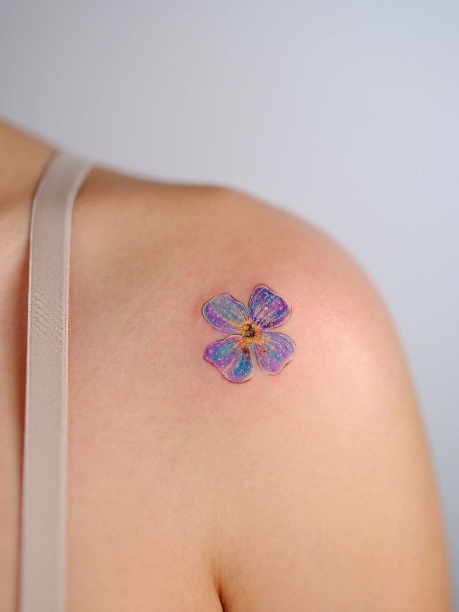 Vibrant floral tattoo exuding tranquility and charm Tattoo on skin