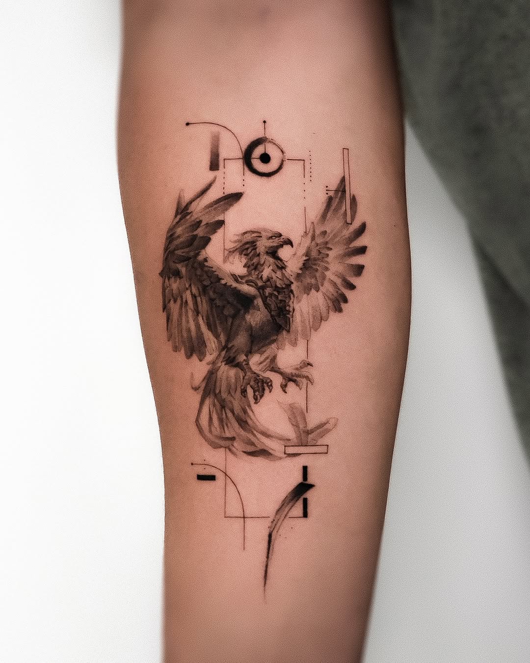 Artistic phoenix tattoo with intricate details Tattoo on skin