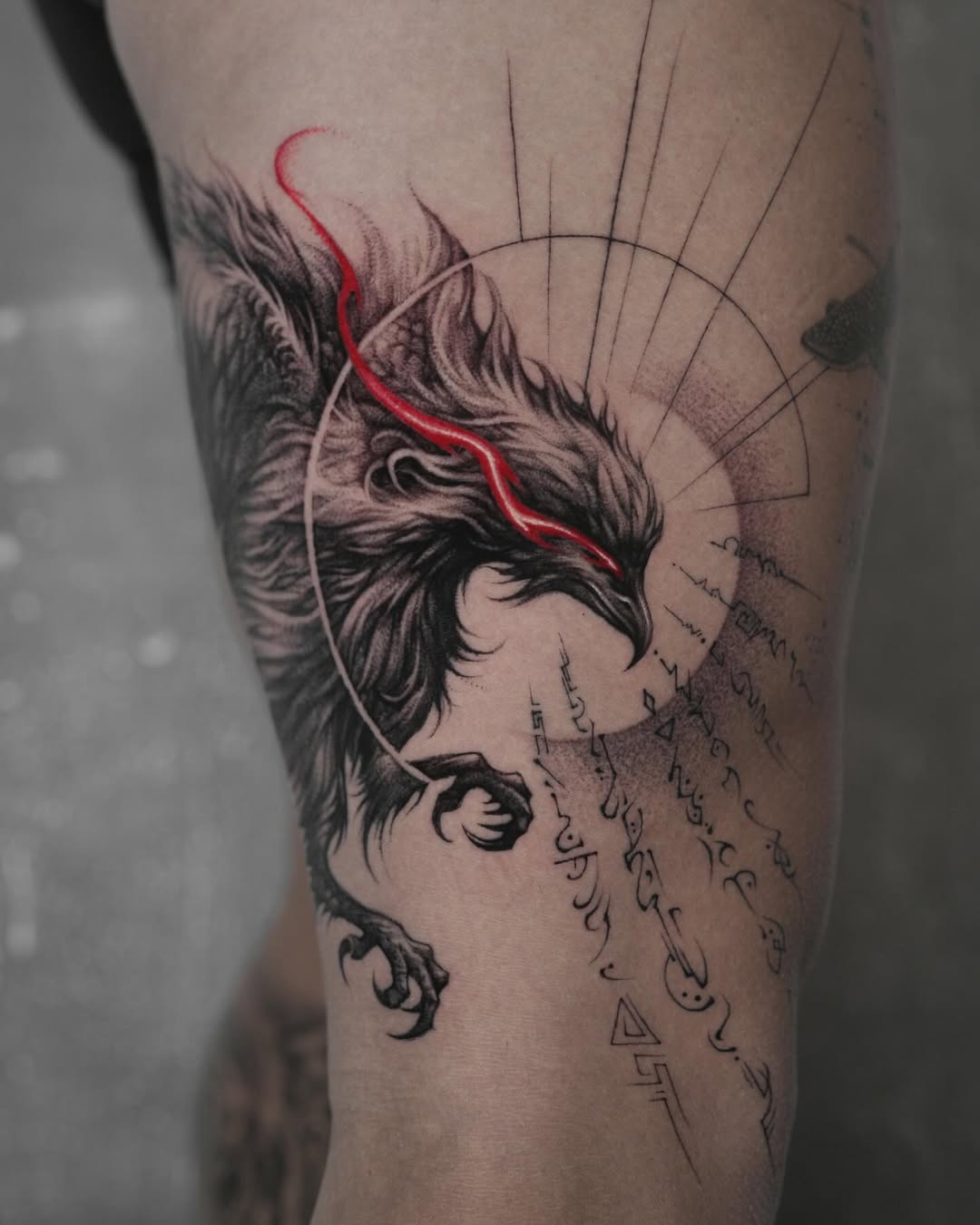 Bold phoenix tattoo with striking red details Tattoo on skin