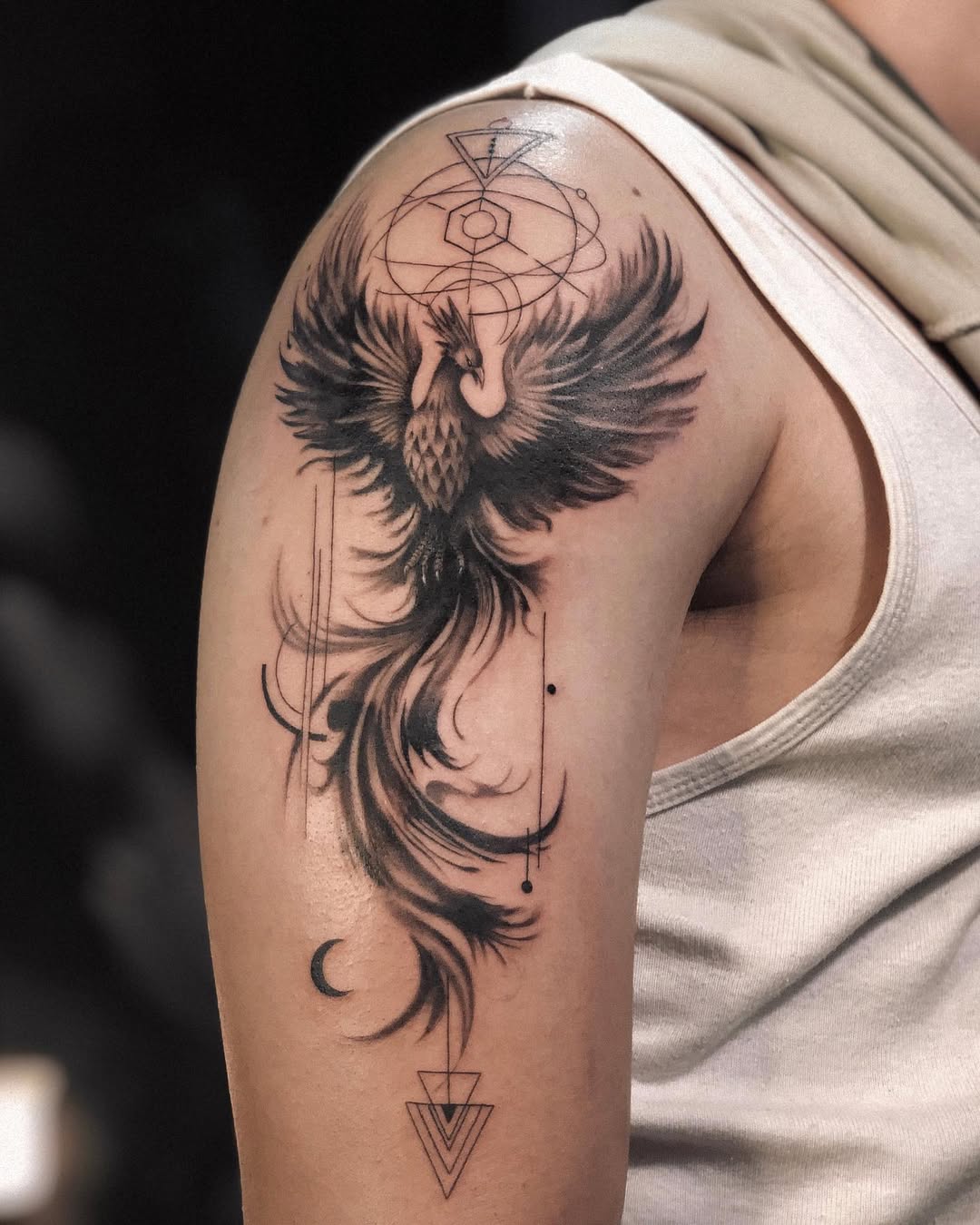 Majestic black phoenix tattoo design on arm Tattoo on skin