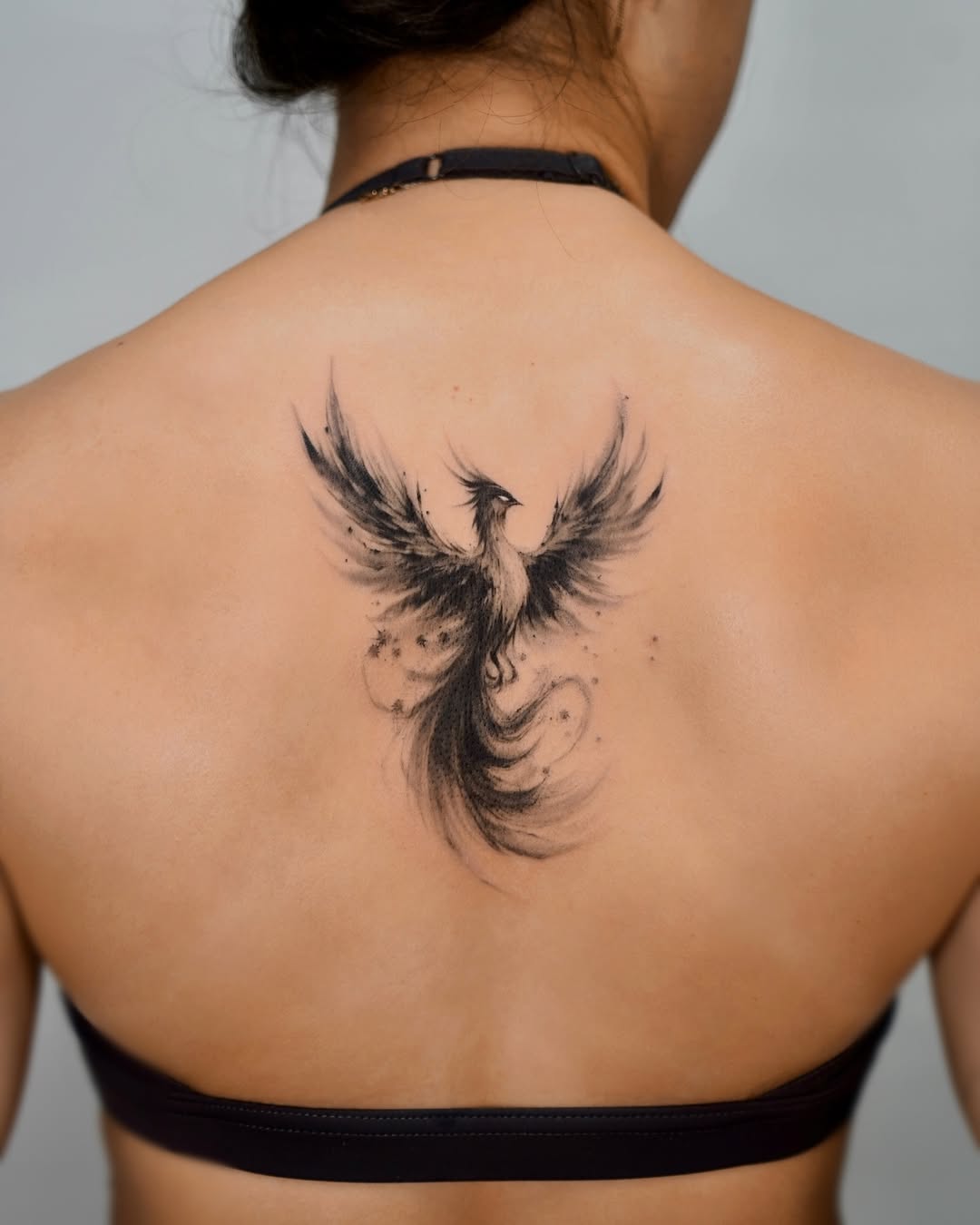 Stunning black ink phoenix tattoo on back phoenix tattoos