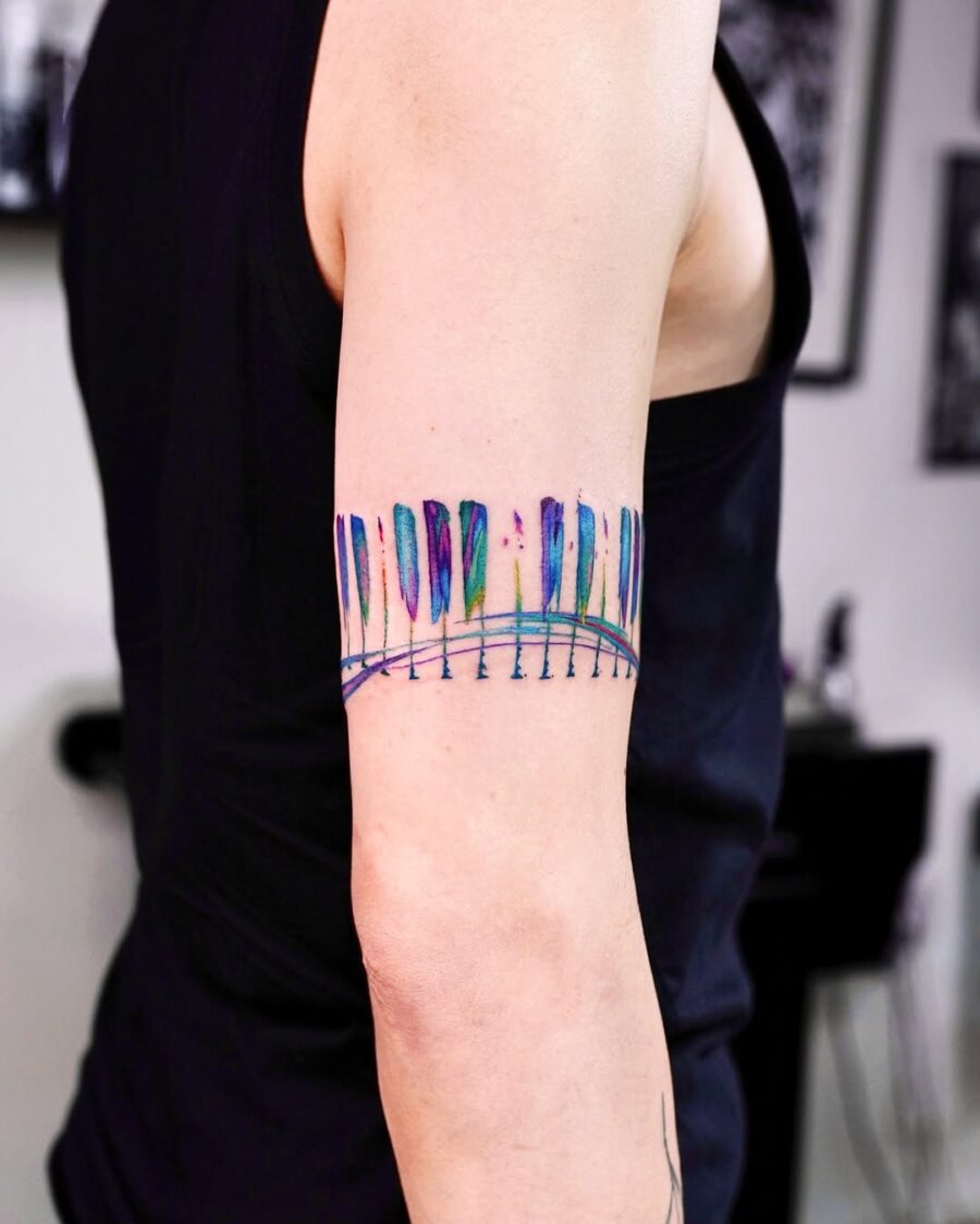 Colorful piano keys tattoo on arm Tattoo on skin