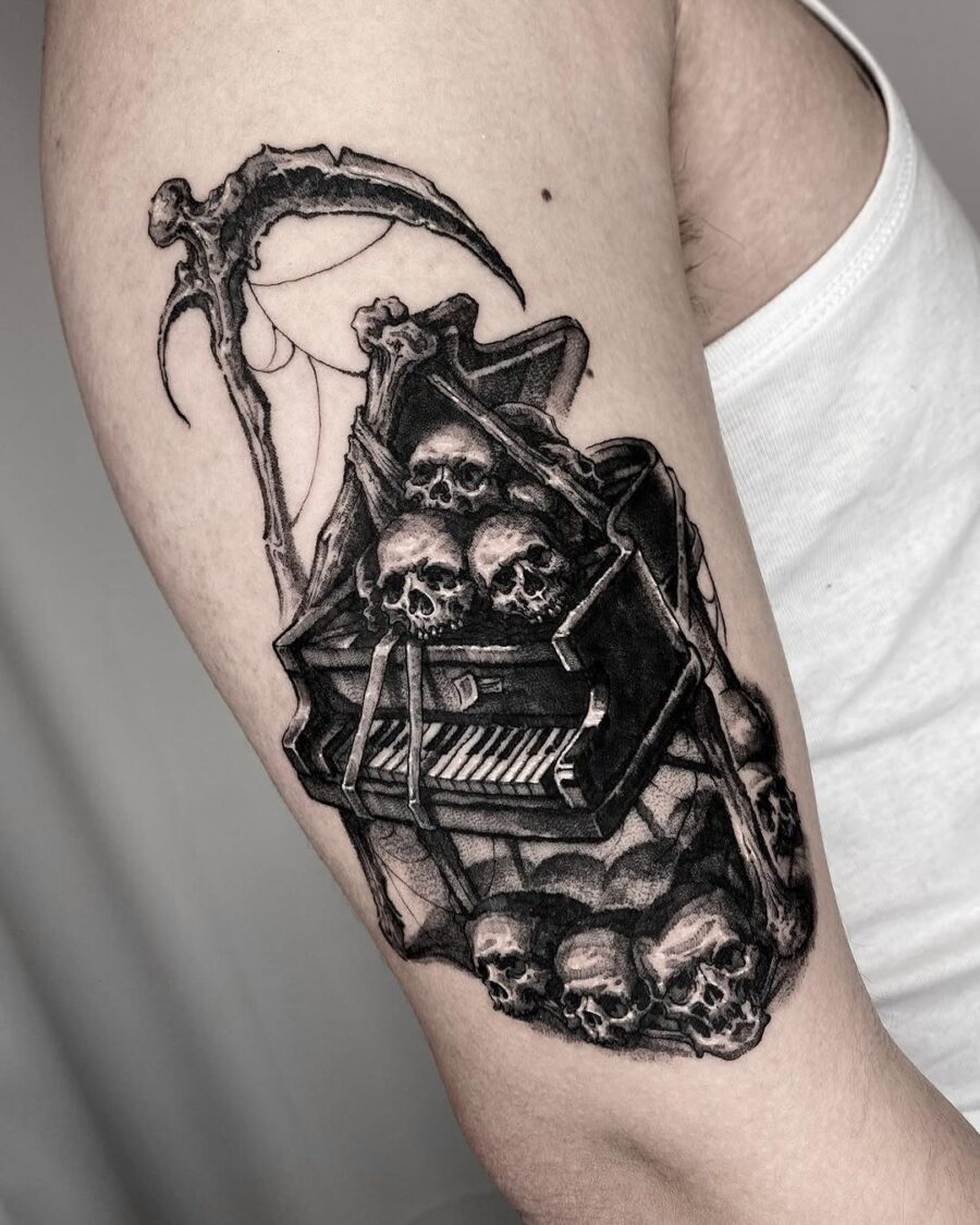 Dark piano tattoo with skeletal vibes Tattoo on skin