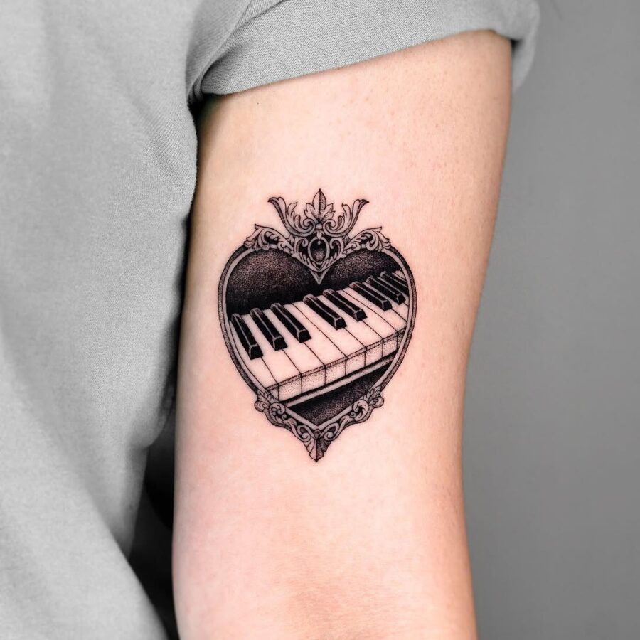 Elegant piano tattoo inside a heart design Tattoo on skin