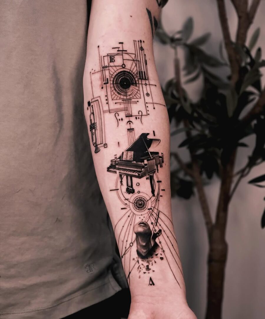 Intricate piano tattoo blending art and melody Tattoo on skin
