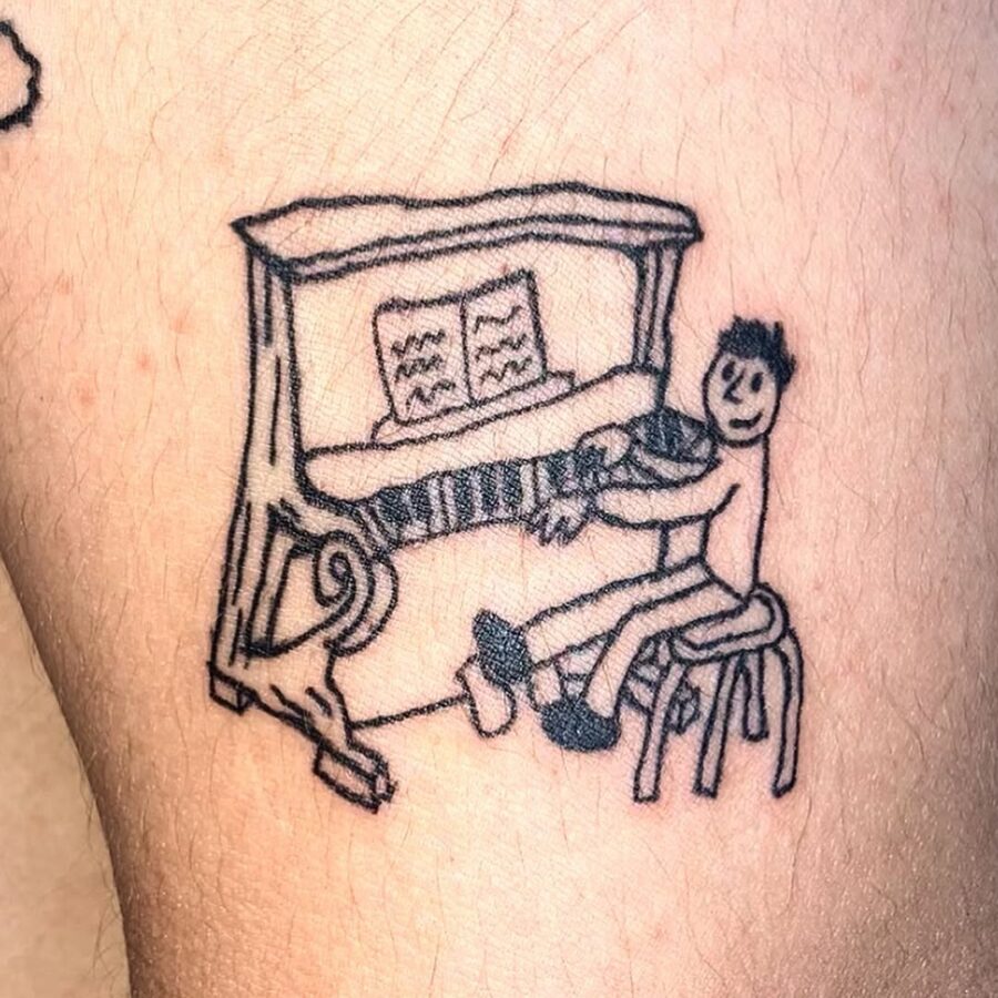 Joyful character playing piano tattoo design Tattoo on skin