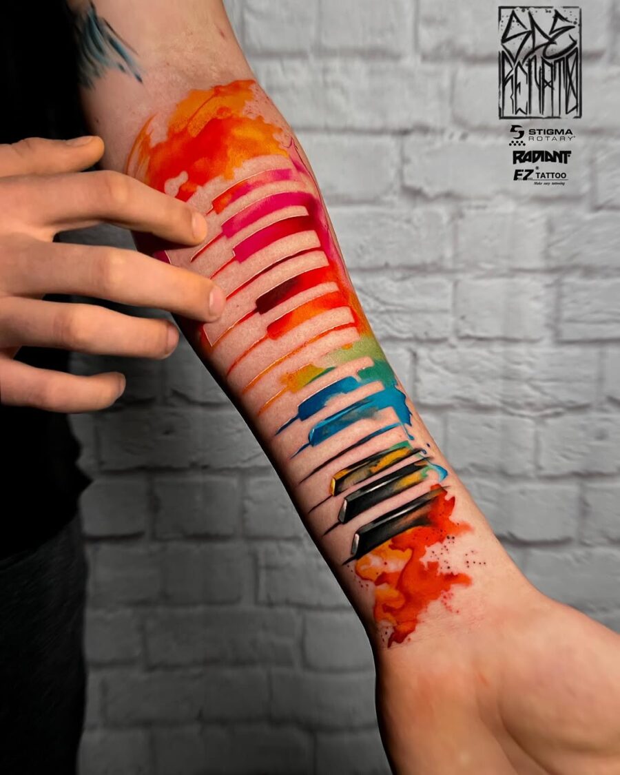 Vibrant Watercolor Piano Tattoo on Forearm Tattoo on skin