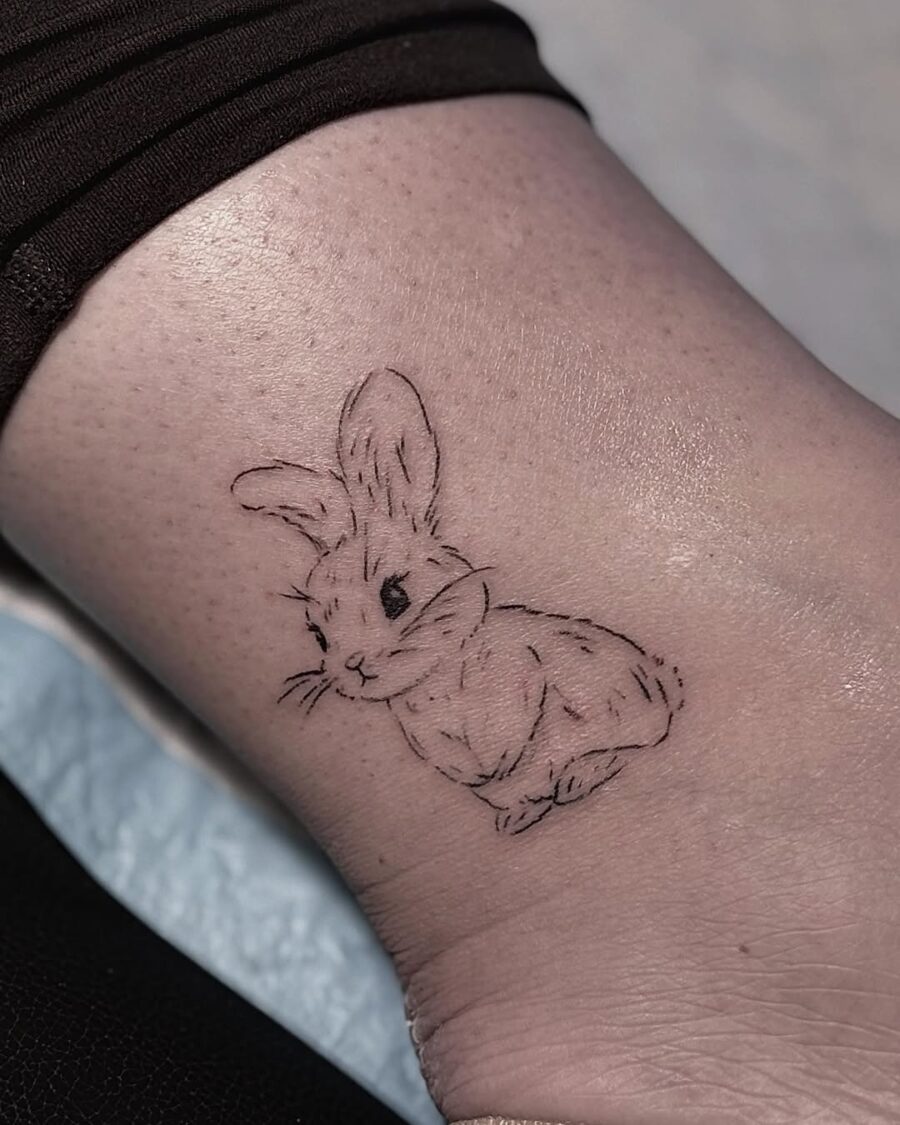 Charming minimalist rabbit tattoo design Tattoo on skin