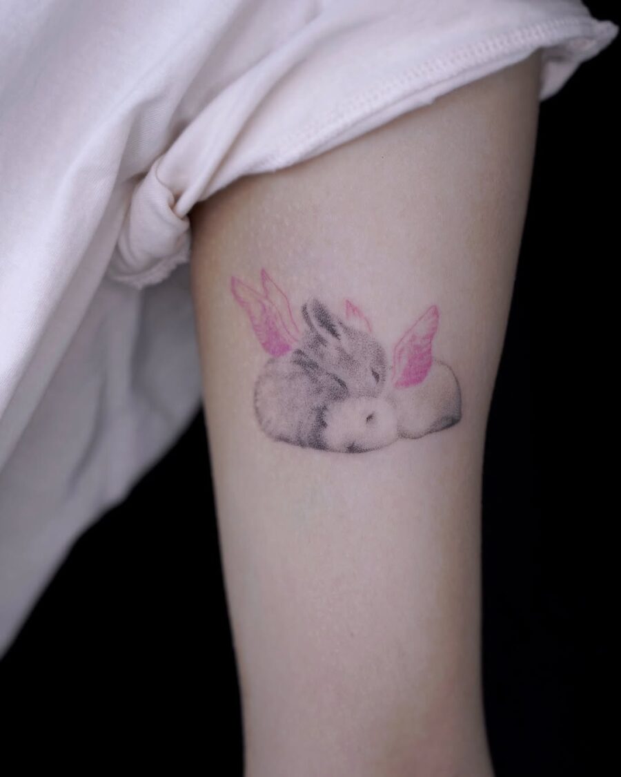 Charming Rabbit Tattoo with Delicate Wings Tattoo on skin