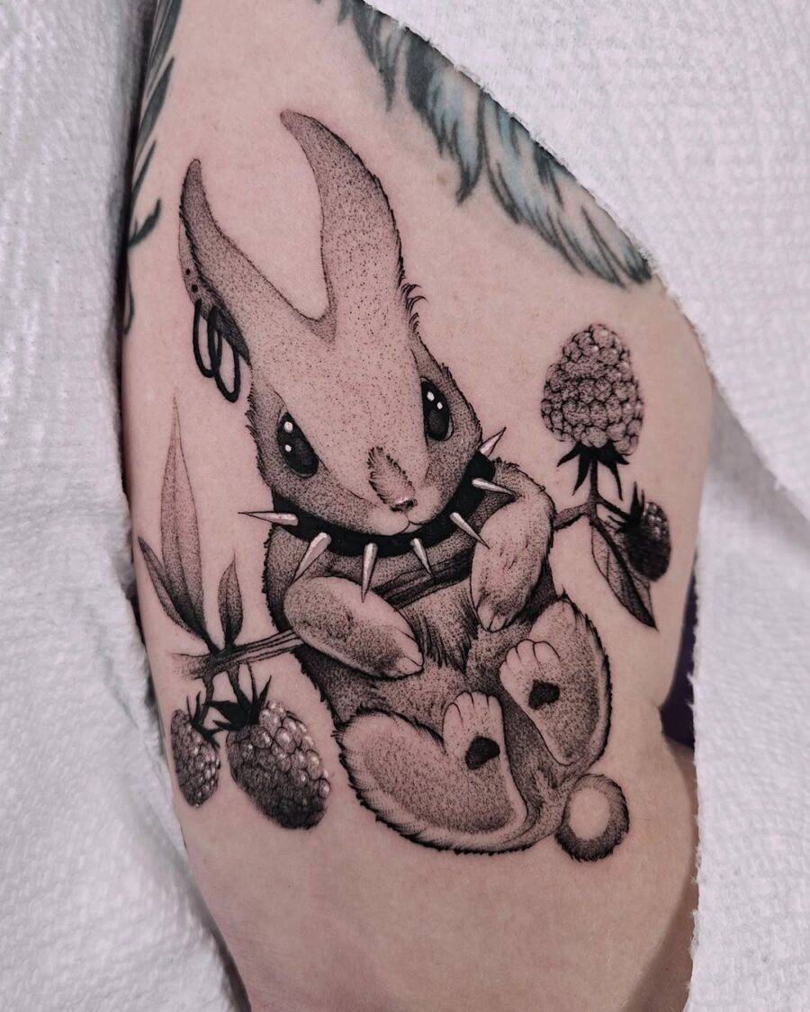 Charming Rabbit Tattoo with Floral Accents Tattoo on skin