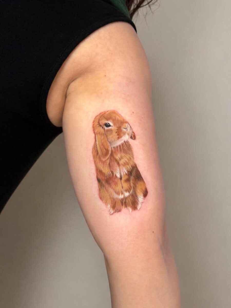Charming Rabbit Tattoo with Lifelike Detail Tattoo on skin
