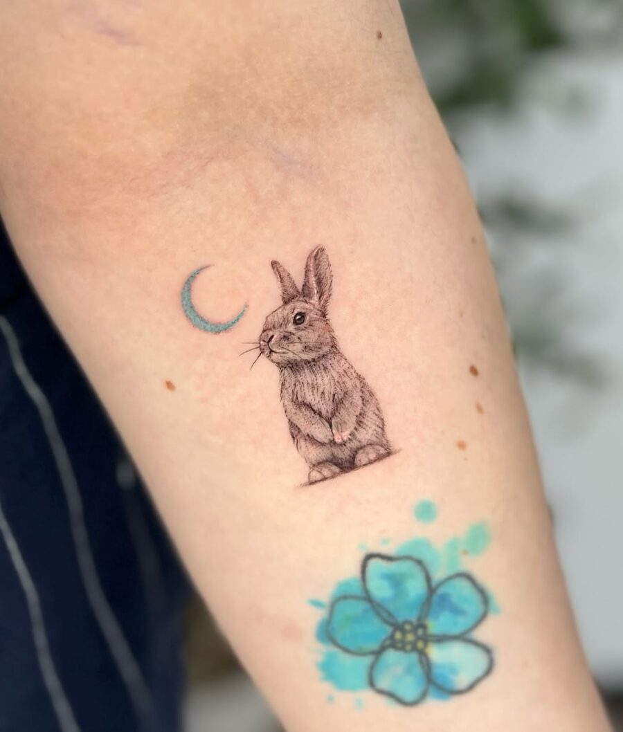 Charming rabbit tattoo with moon and flower Tattoo on skin