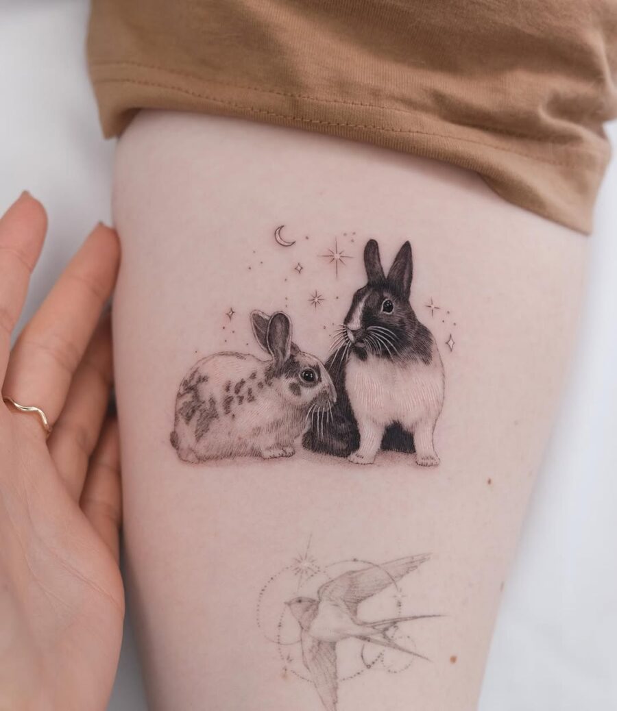 Charming rabbits tattoo showcasing intricate detailing Tattoo on skin