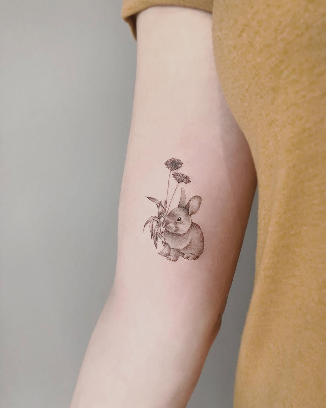 Charming realistic rabbit tattoo design ideas Tattoo on skin