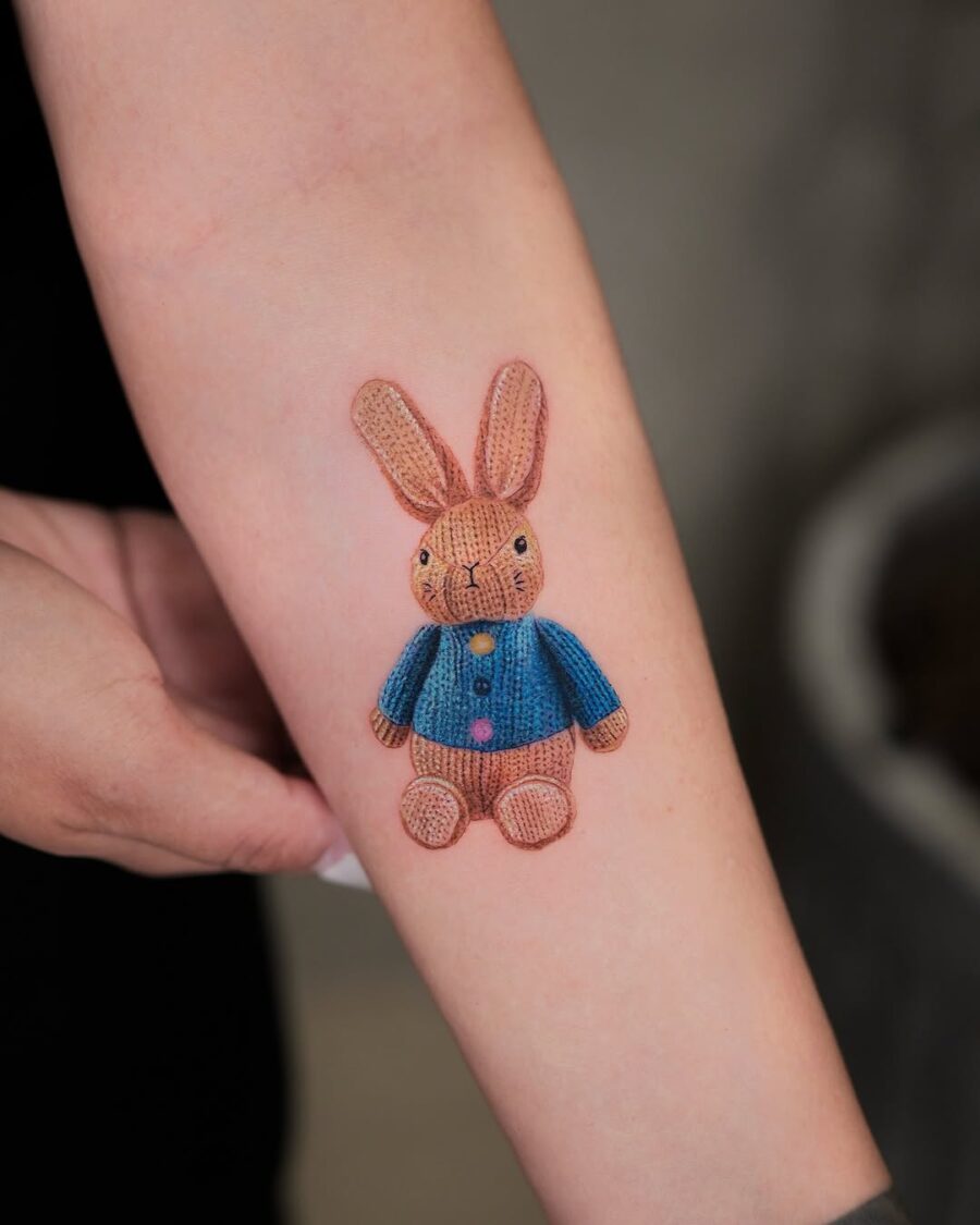 Cute rabbit tattoo with knitted texture Tattoo on skin