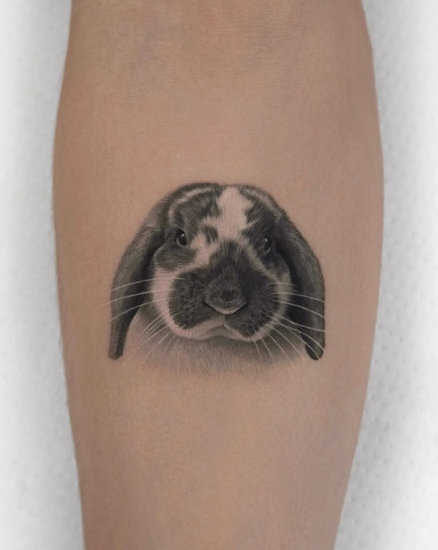 Detailed black and gray rabbit tattoo design Tattoo on skin