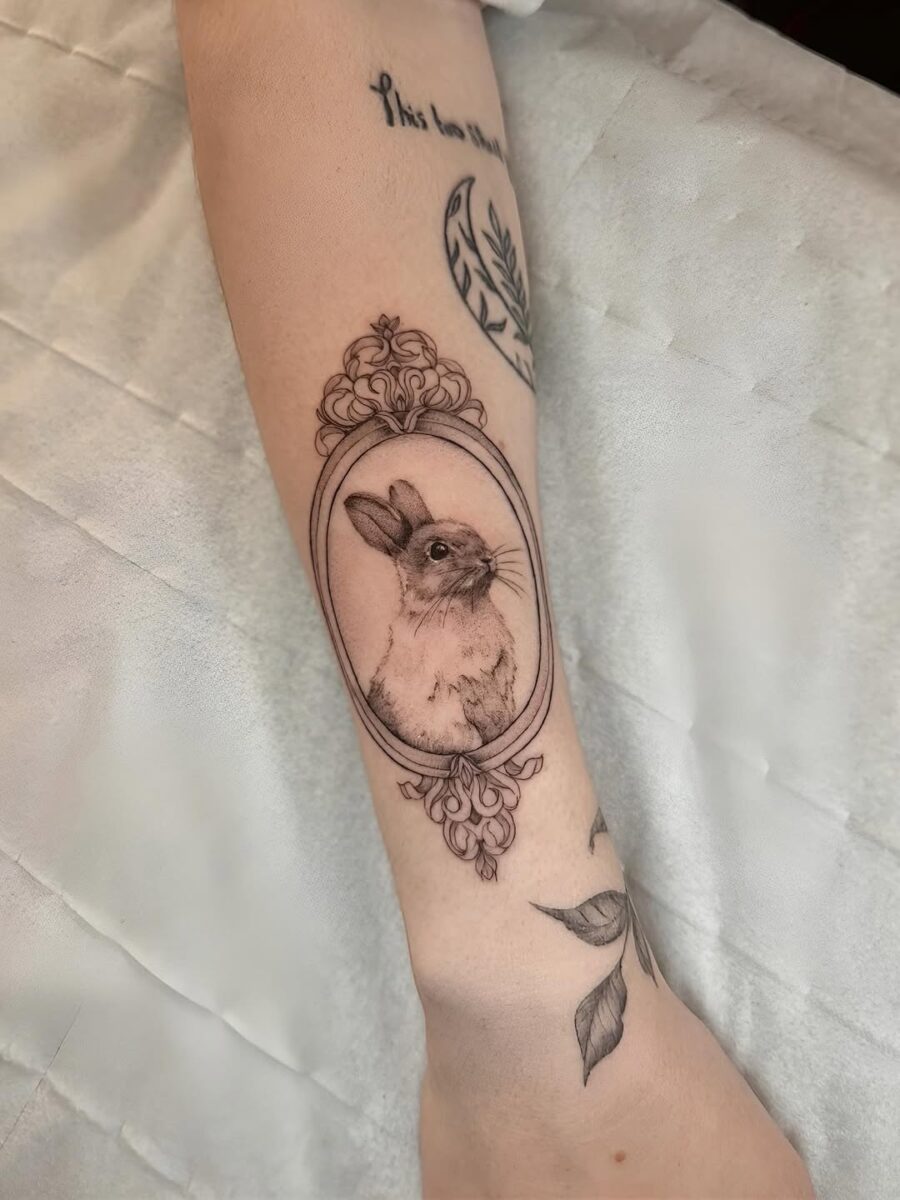 Framed rabbit tattoo with elegant detail Tattoo on skin
