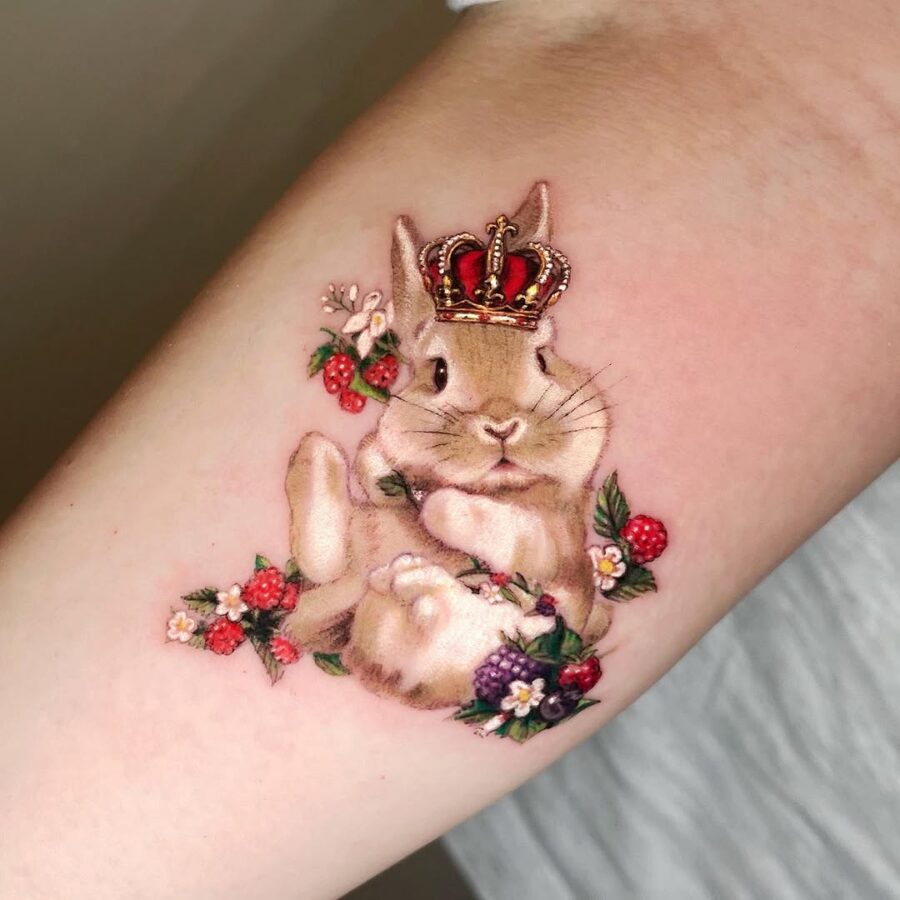 Majestic rabbit tattoo adorned with floral elements Tattoo on skin