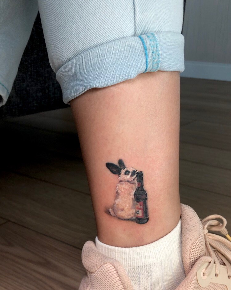 Whimsical rabbit tattoo with a playful touch Tattoo on skin