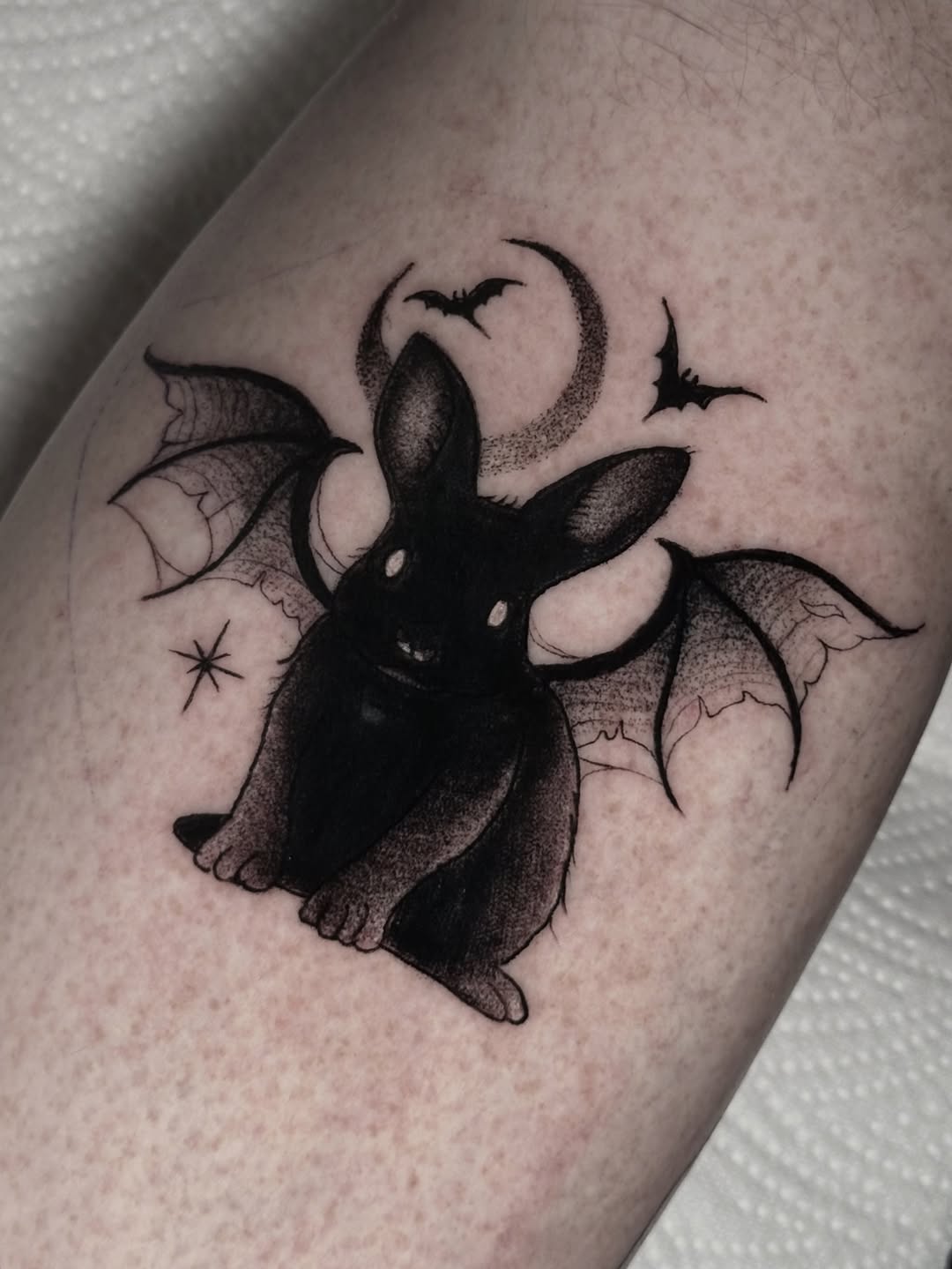 Whimsical rabbit tattoo with bat wings Tattoo on skin