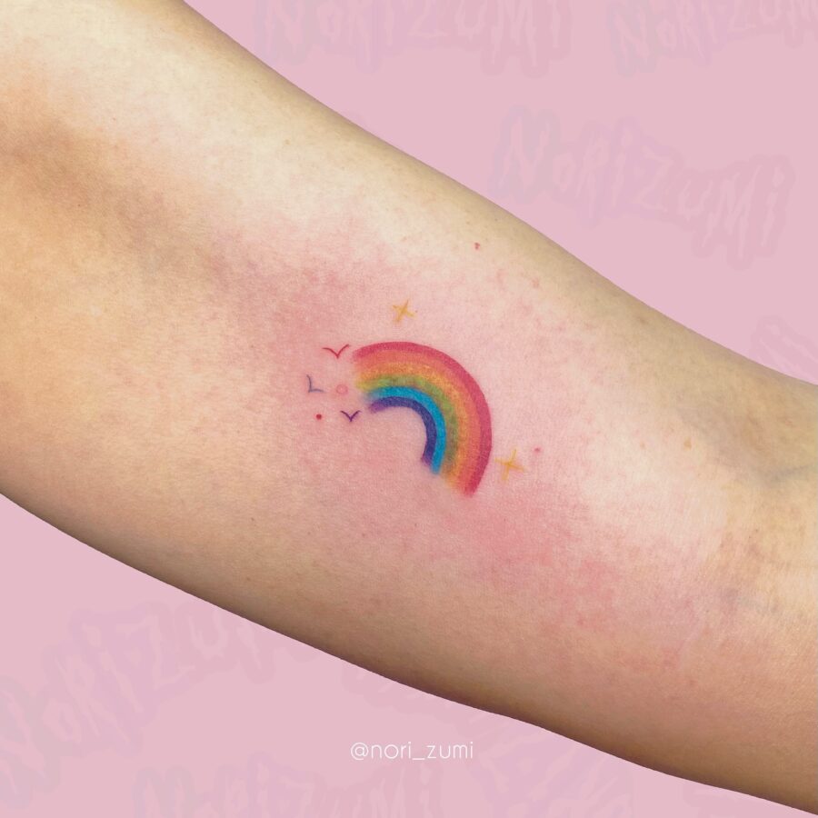 Charming rainbow tattoo celebrating new beginnings Tattoo on skin