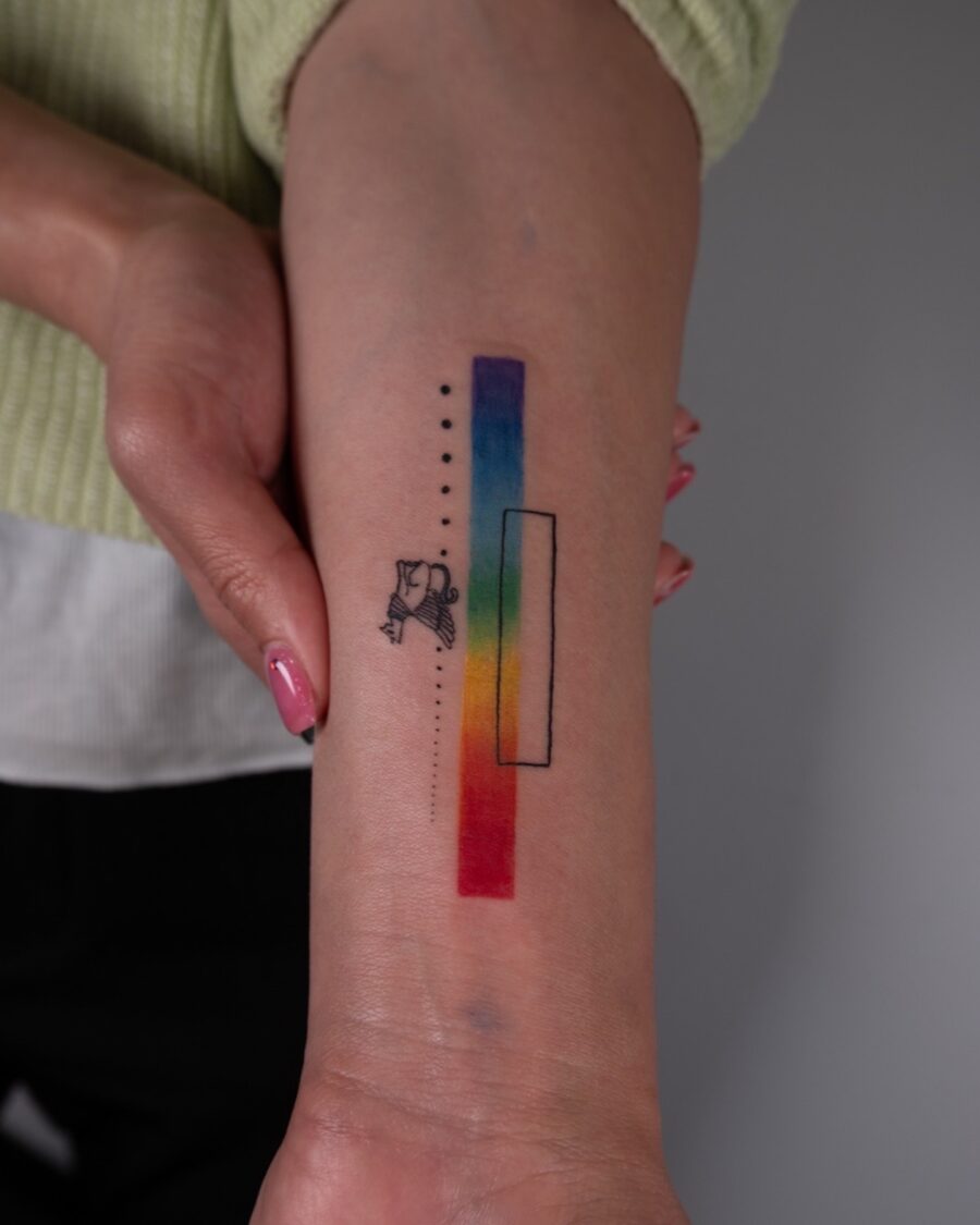Colorful rainbow baby tattoo on the arm rainbow baby tattoos
