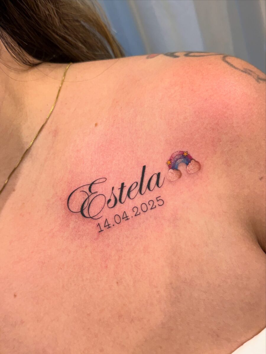 Heartfelt rainbow tattoo honoring a lost child Tattoo on skin