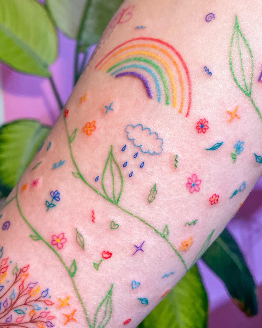 Vibrant Rainbow Baby Tattoo Celebrating Life Tattoo on skin