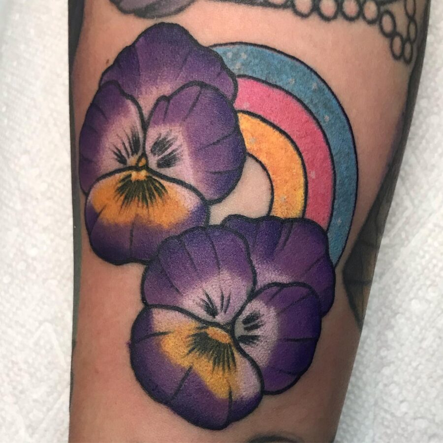 Vibrant rainbow baby tattoo with pansies Tattoo on skin