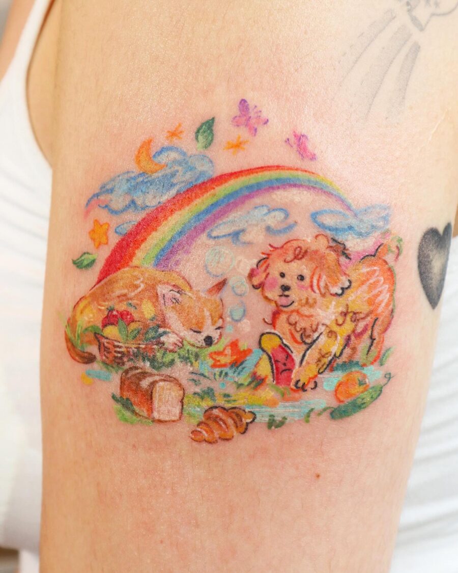 Vibrant rainbow baby tattoo with playful animals Tattoo on skin