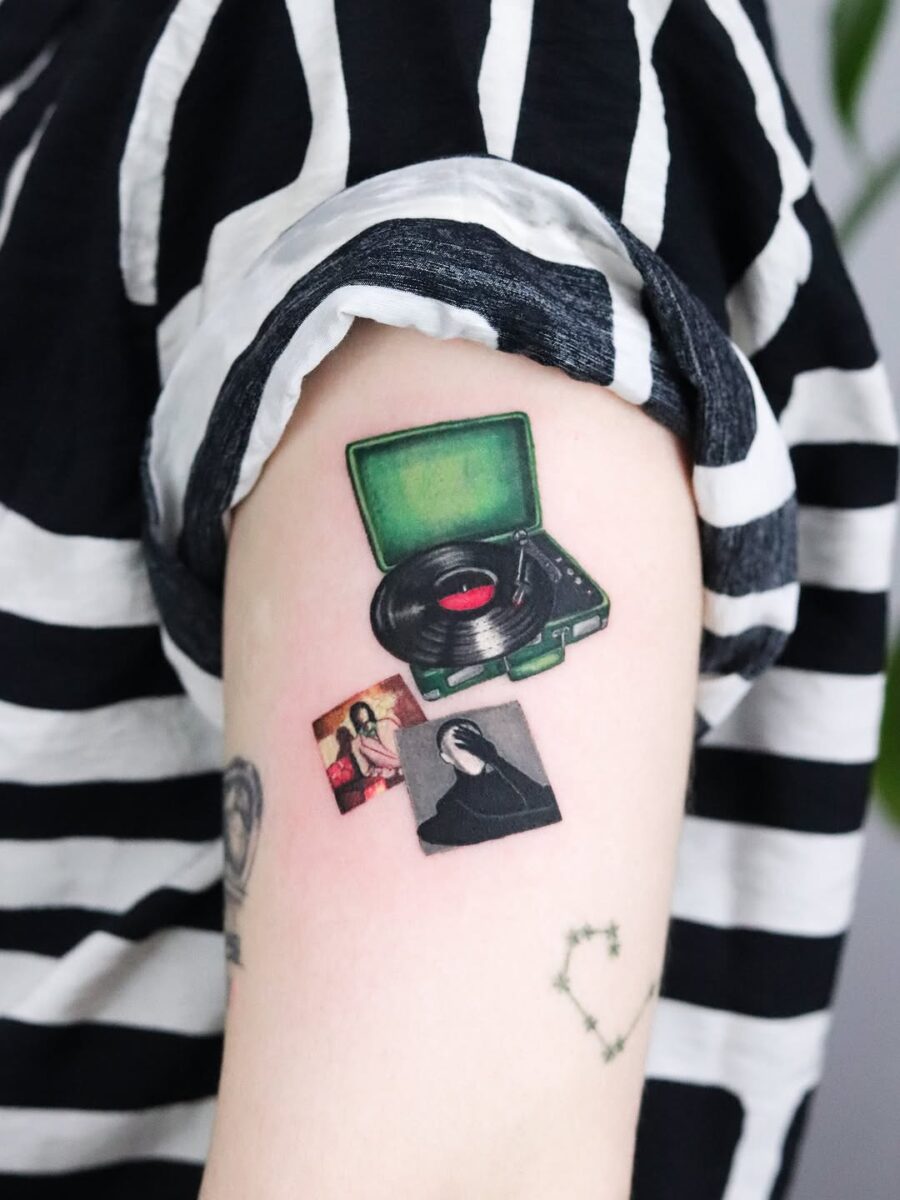 Charming vintage record player tattoo design Tattoo on skin
