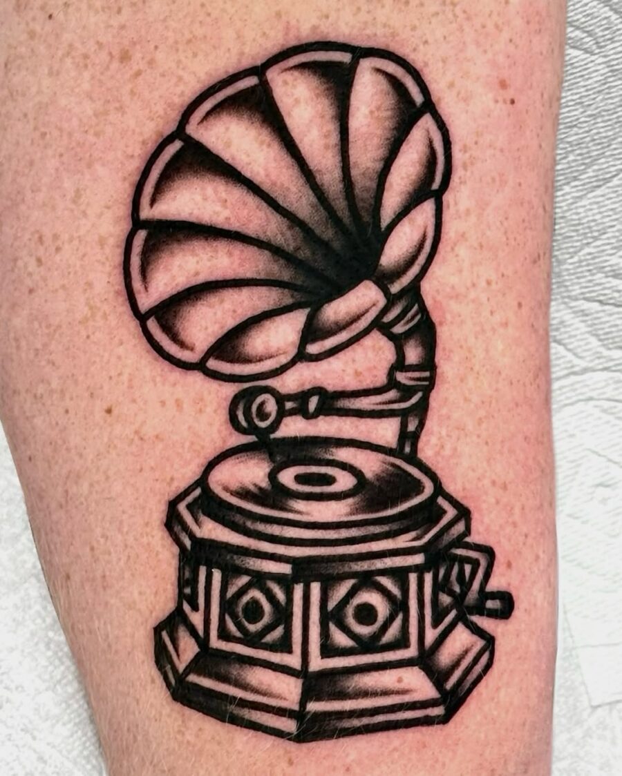 Classic gramophone tattoo with intricate details Tattoo on skin