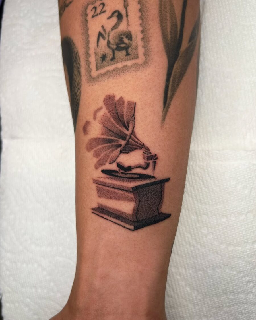 Classic tattoo featuring a vintage record player Tattoo on skin