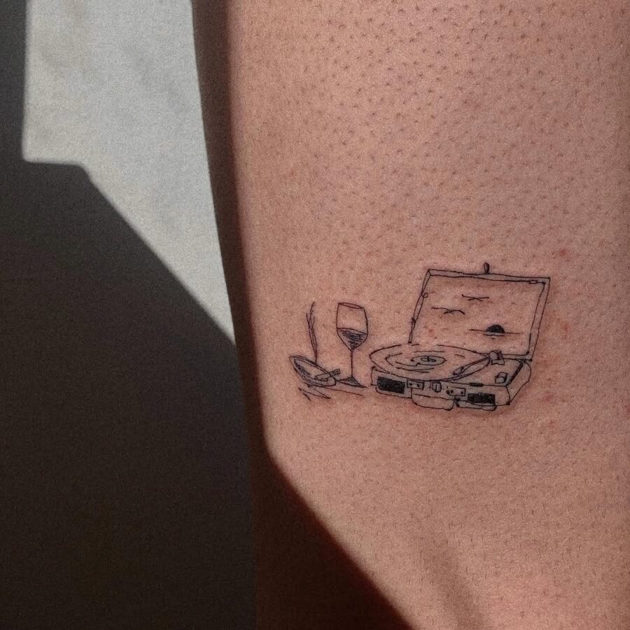 Creative record player tattoo with wine glass Tattoo on skin