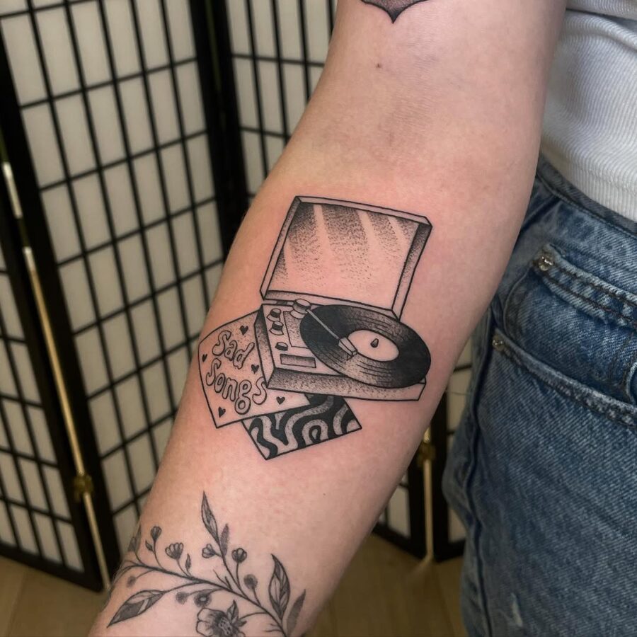 Ink of nostalgia with a sad song vibe Tattoo on skin