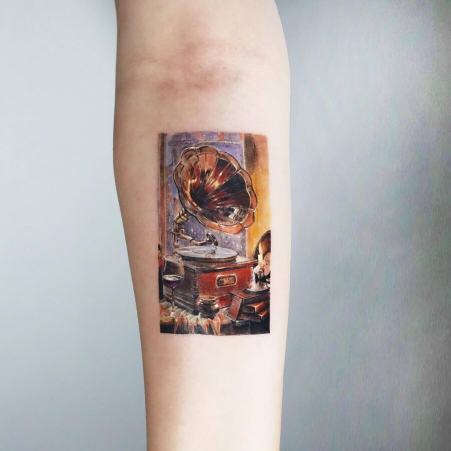 Intricate design of a vintage record player tattoo Tattoo on skin