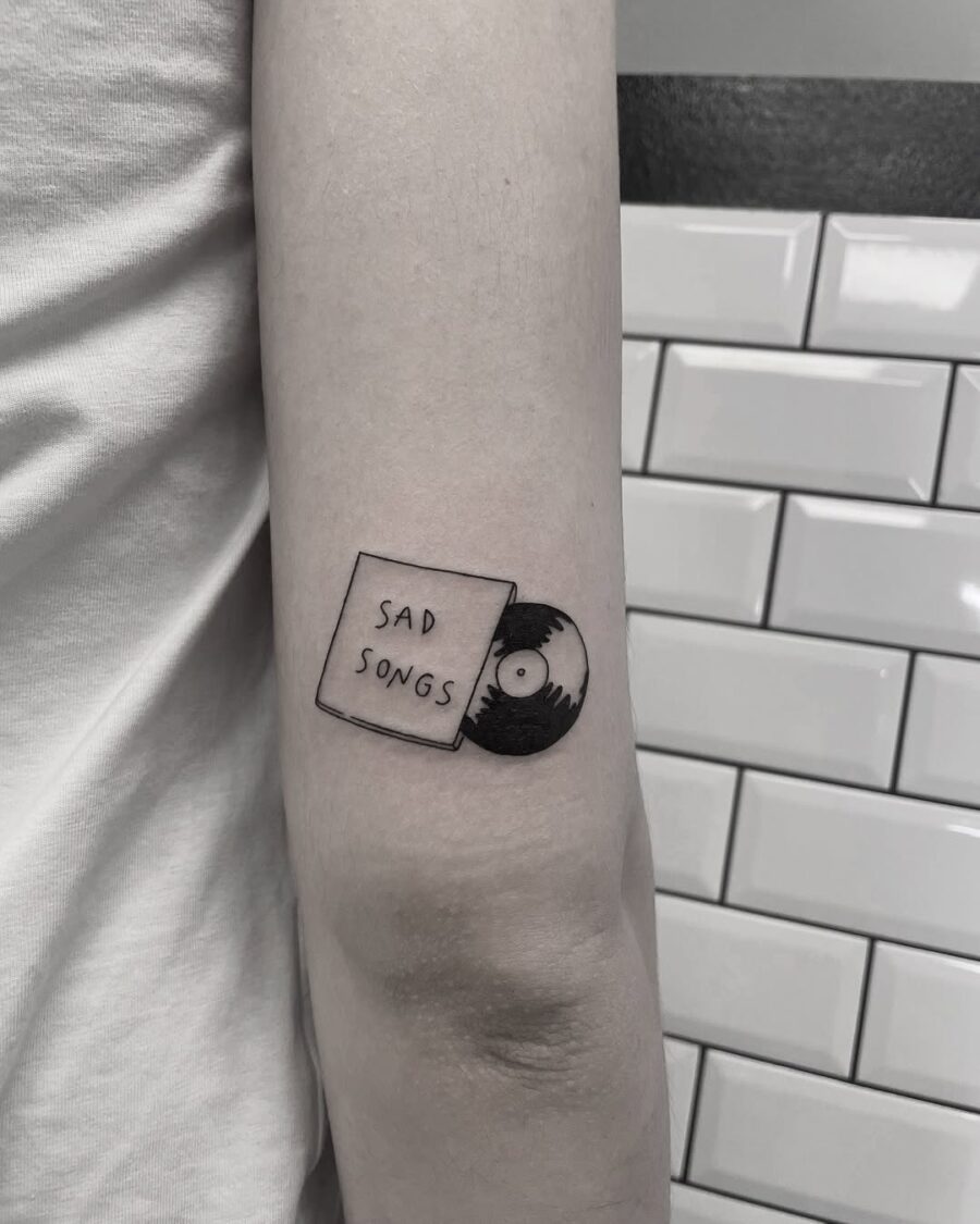 Melancholic vibes captured in tattoo form Tattoo on skin