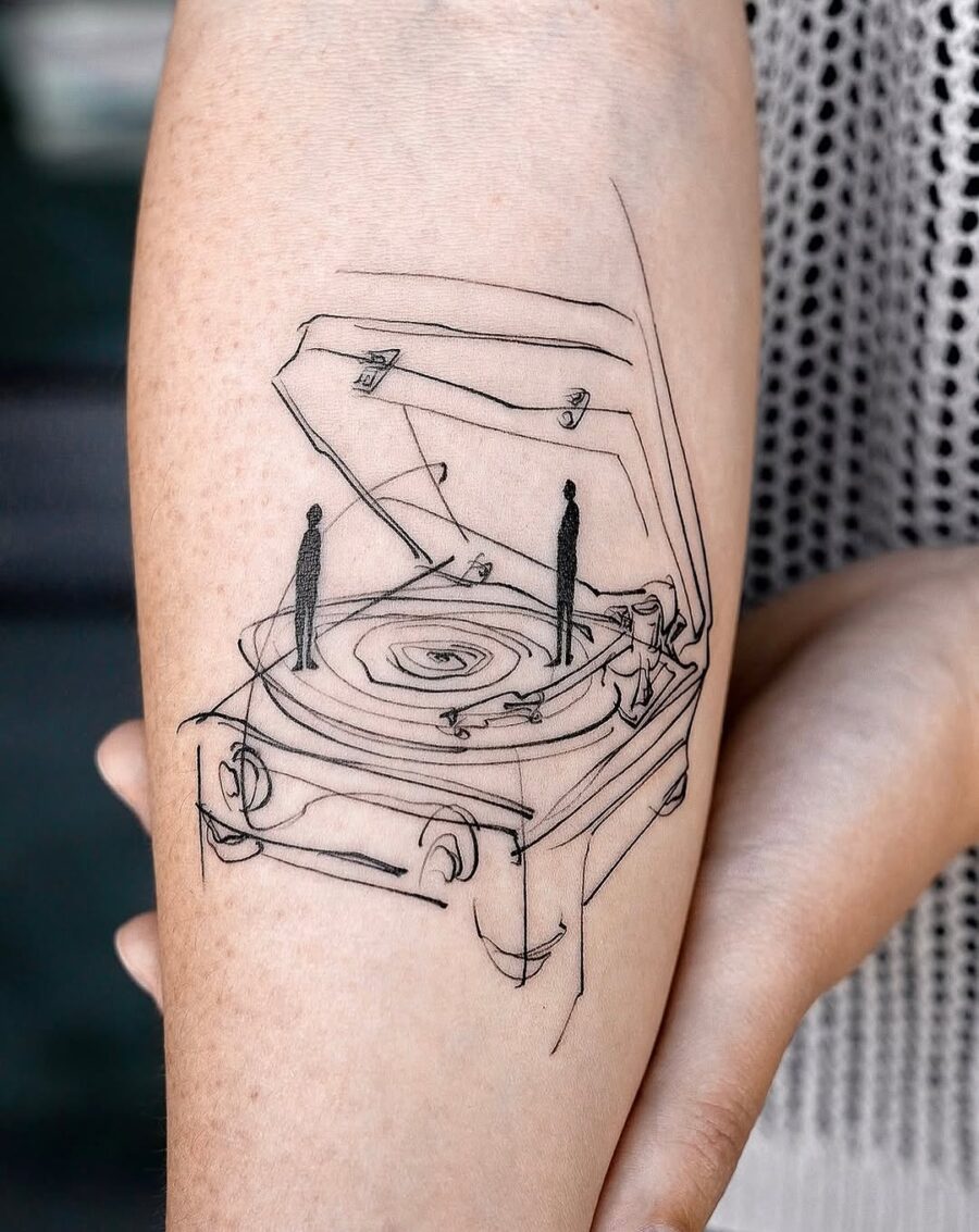 Minimalist record player tattoo with silhouettes Tattoo on skin