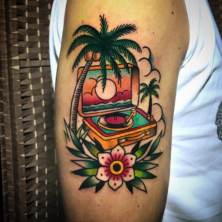 Retro record player with tropical vibes Tattoo on skin