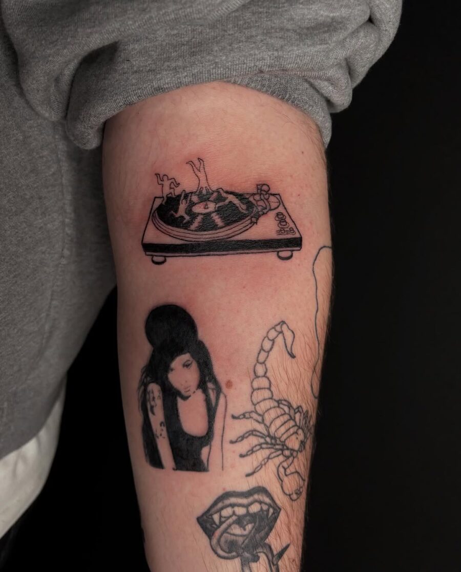 Stylish ink celebrates vinyl culture and artistry Tattoo on skin